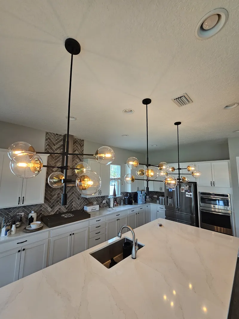 Kitchen island under globe pendant lights