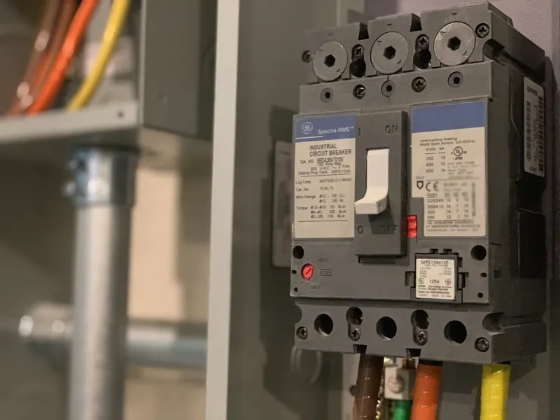 Molded-case circuit breaker in an electrical enclosure