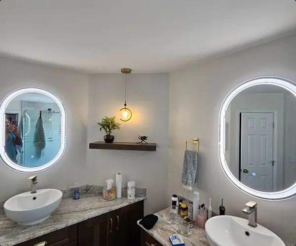 Double vanity with lighted mirrors